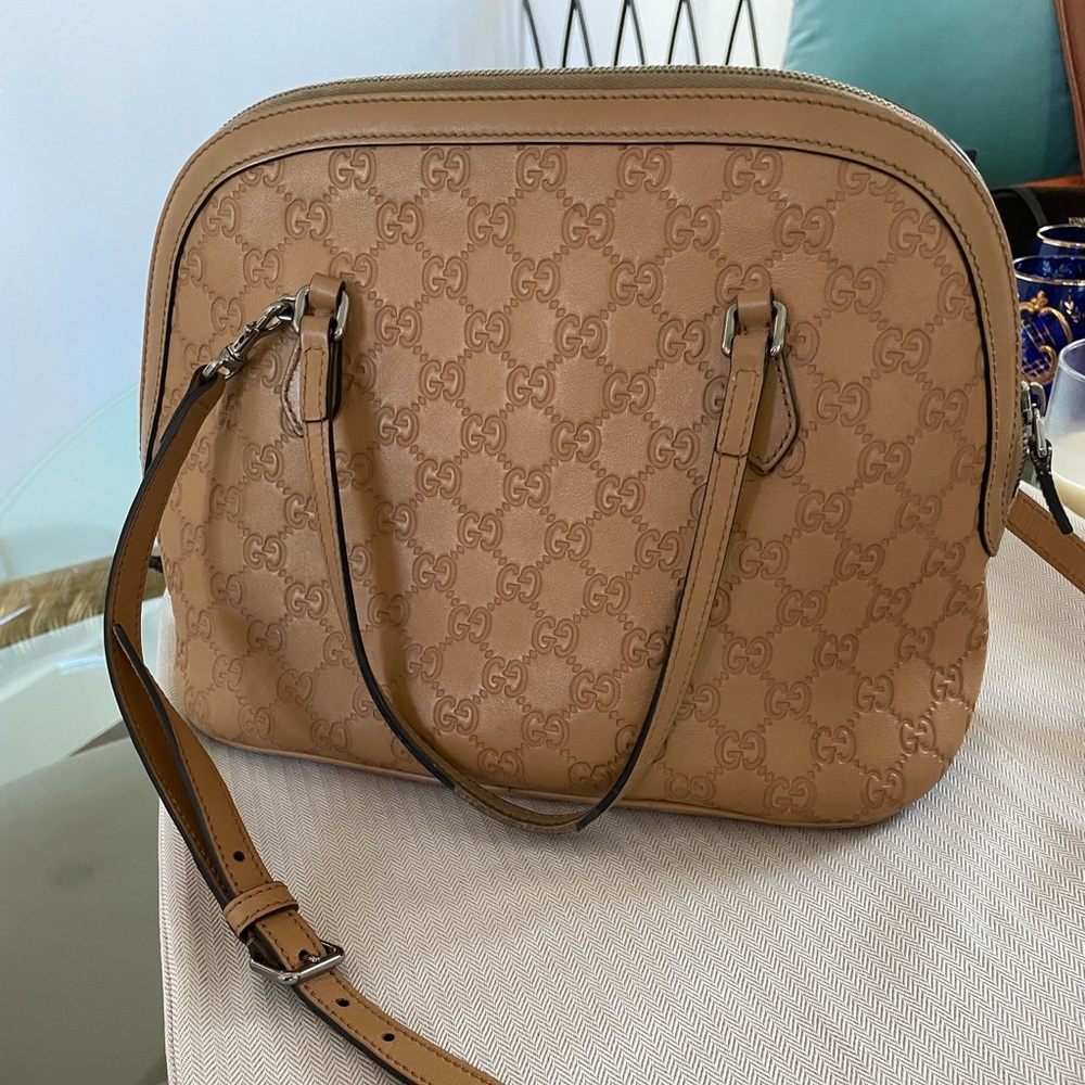 Gucci cream purse used.